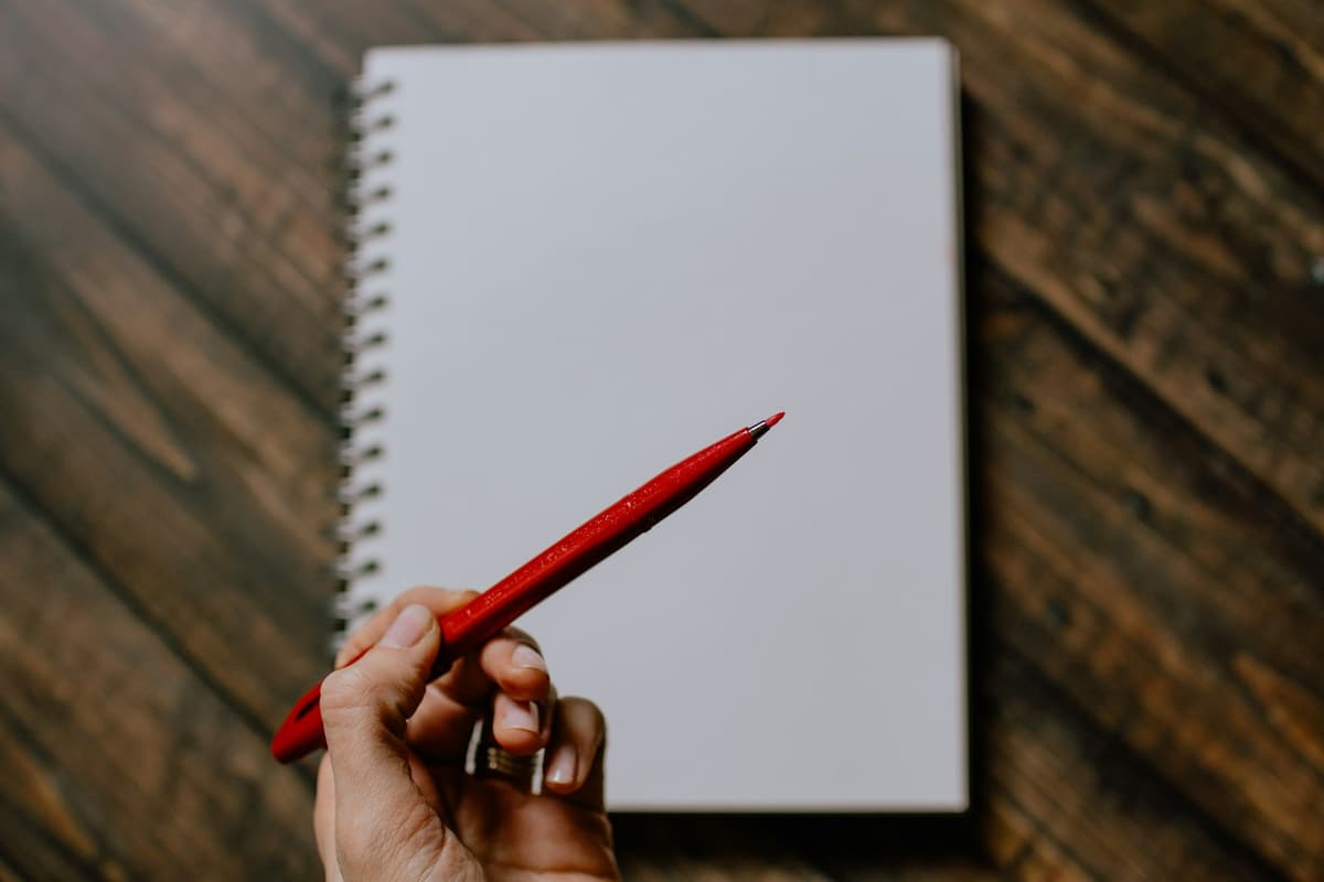 AI workslop: red pen marking corrections on an AI-generated PRD